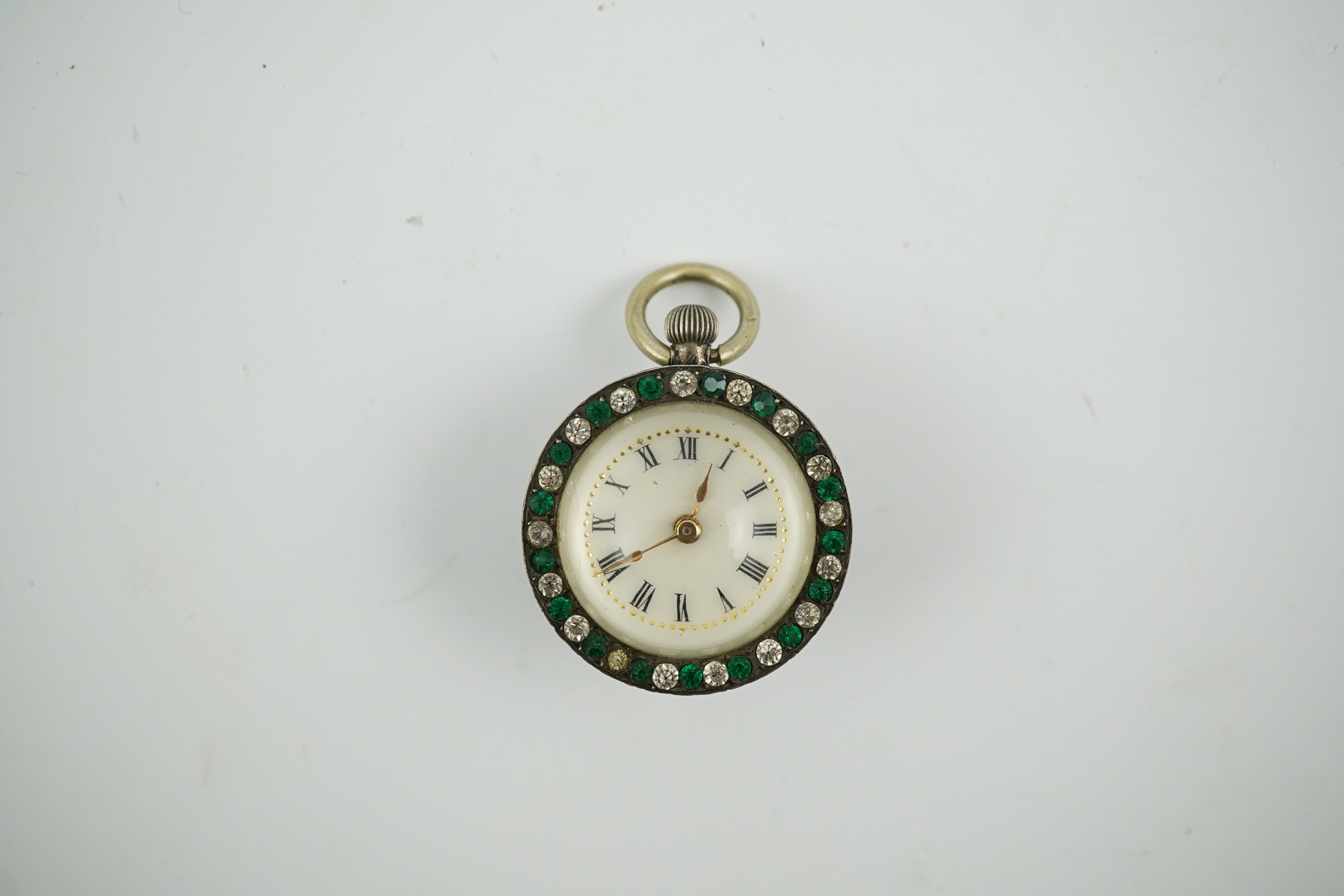 An early 20th century white metal and two colour paste set bullseye fob watch, with Roman dial, 30mm. Condition - poor to fair